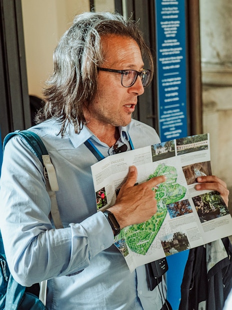 Guide explaining map during Royal Palace of Caserta small-group tour.