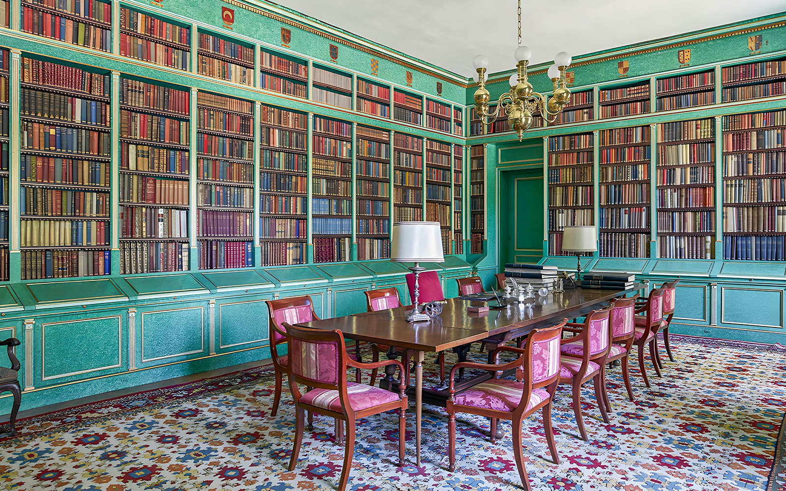 Liria Palace library in Madrid with ornate bookshelves and historical artifacts.