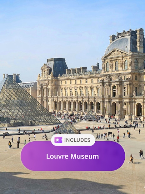 Louvre Museum courtyard with glass pyramid in Paris.