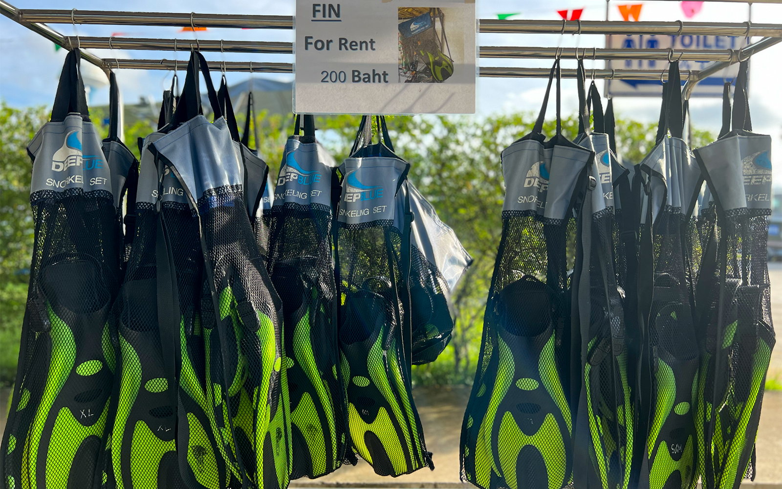 Snorkeling fins for rent displayed in Phuket, Thailand.