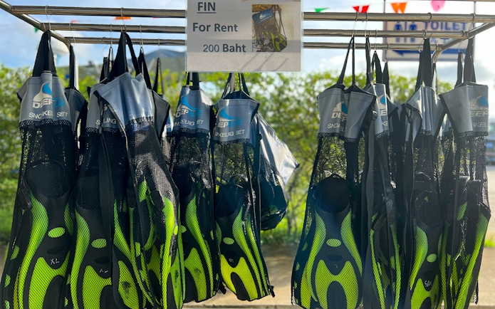 Snorkeling fins for rent displayed in Phuket, Thailand.