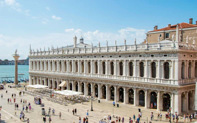 Doge's Palace in Venice with tourists in the courtyard, part of the Venice Museums Pass.