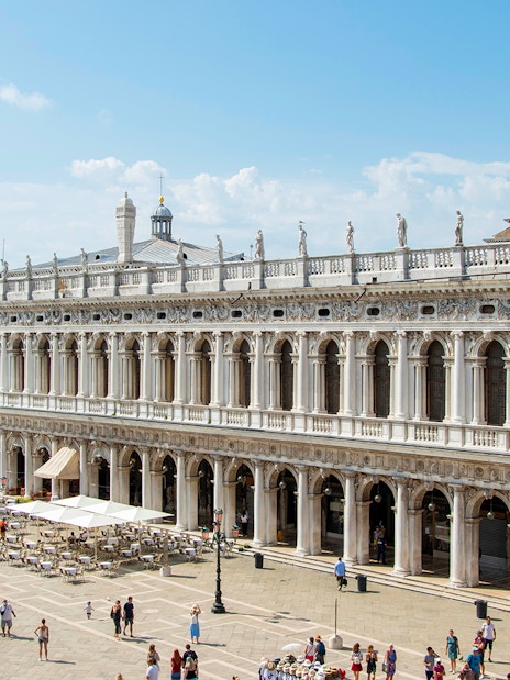 Doge's Palace in Venice with tourists in the courtyard, part of the Venice Museums Pass.