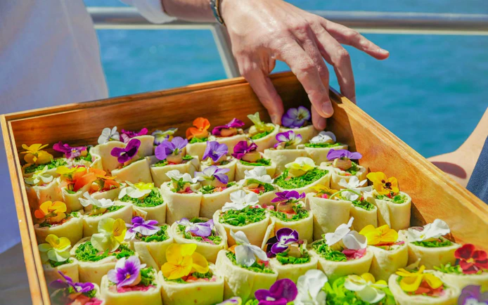 Brunch wraps with edible flowers on a cruise from Lagos to Ponta da Piedade.
