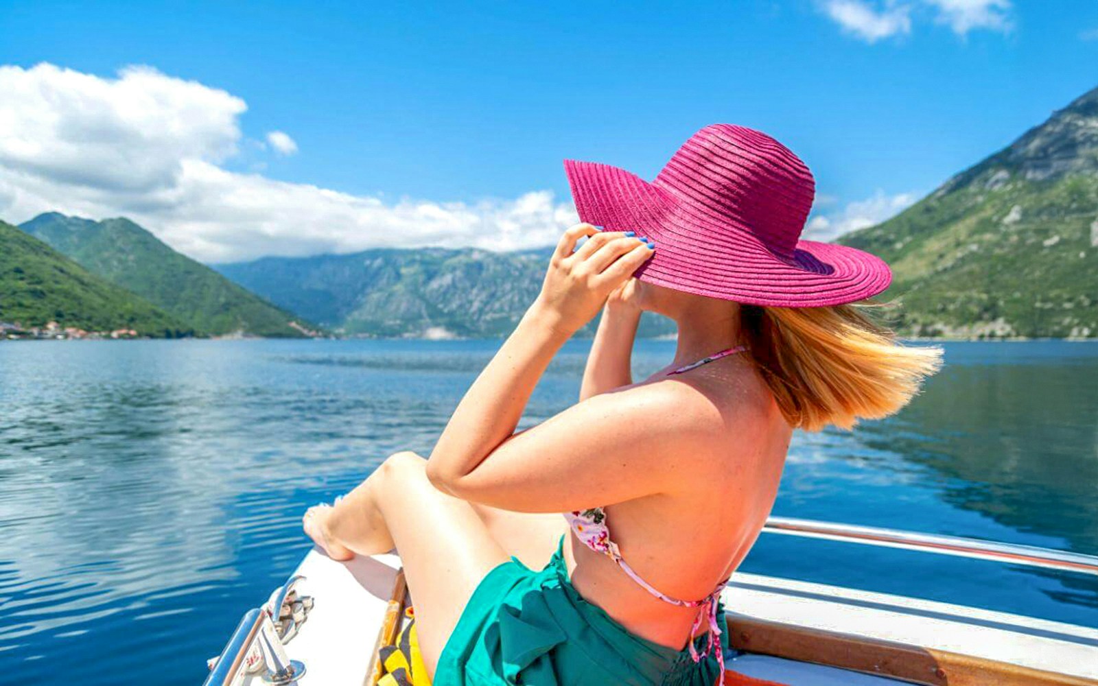 Guests on speedboat enjoying Bay of Kotor views during Blue Cave tour.