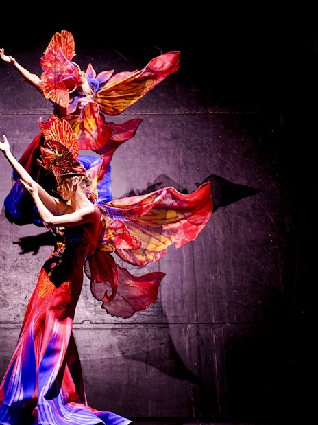 Dancers in vibrant costumes performing at the Christmas show, Paradis Latin, Paris.