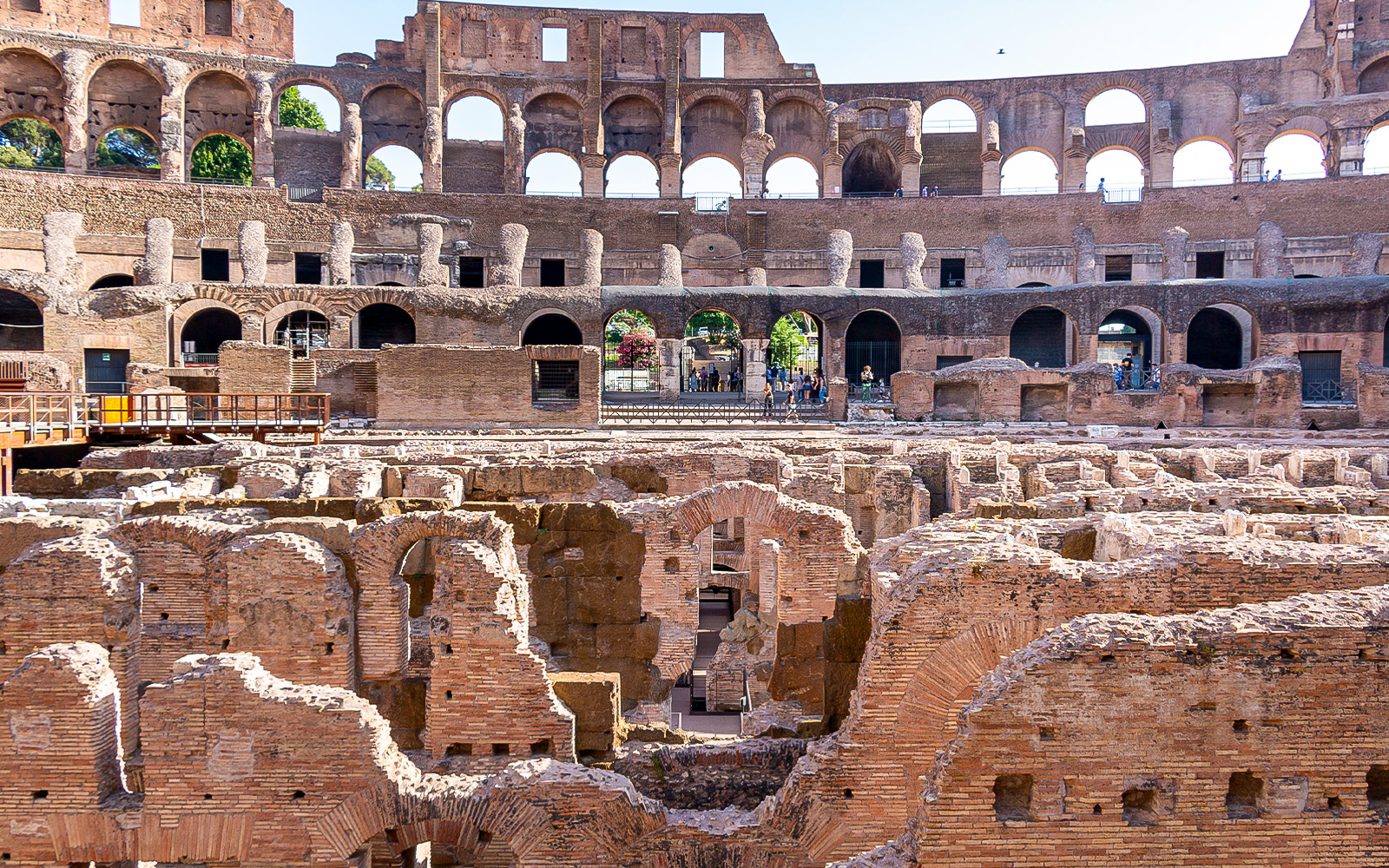 Gladiator arena ruins inside the Colosseum, Rome, showcasing ancient architecture.
