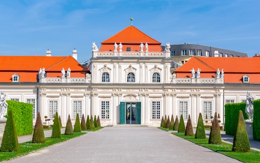 Lower Belvedere palace facade with statues and manicured gardens, Vienna.