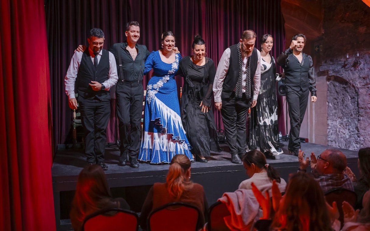 Performers bowing at Palau Dalmases Flamenco Show in Barcelona.