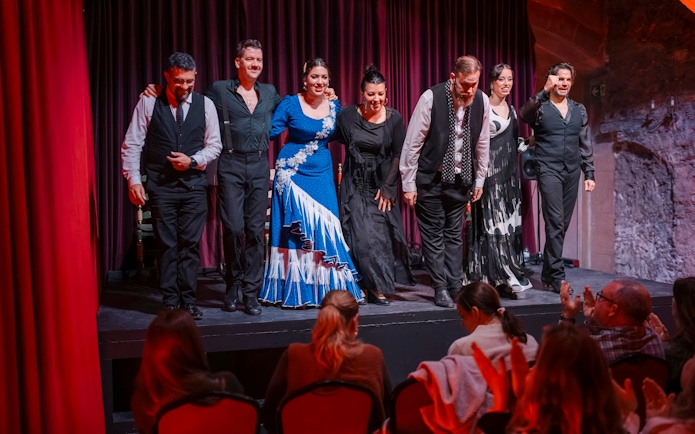 Performers bowing at Palau Dalmases Flamenco Show in Barcelona.