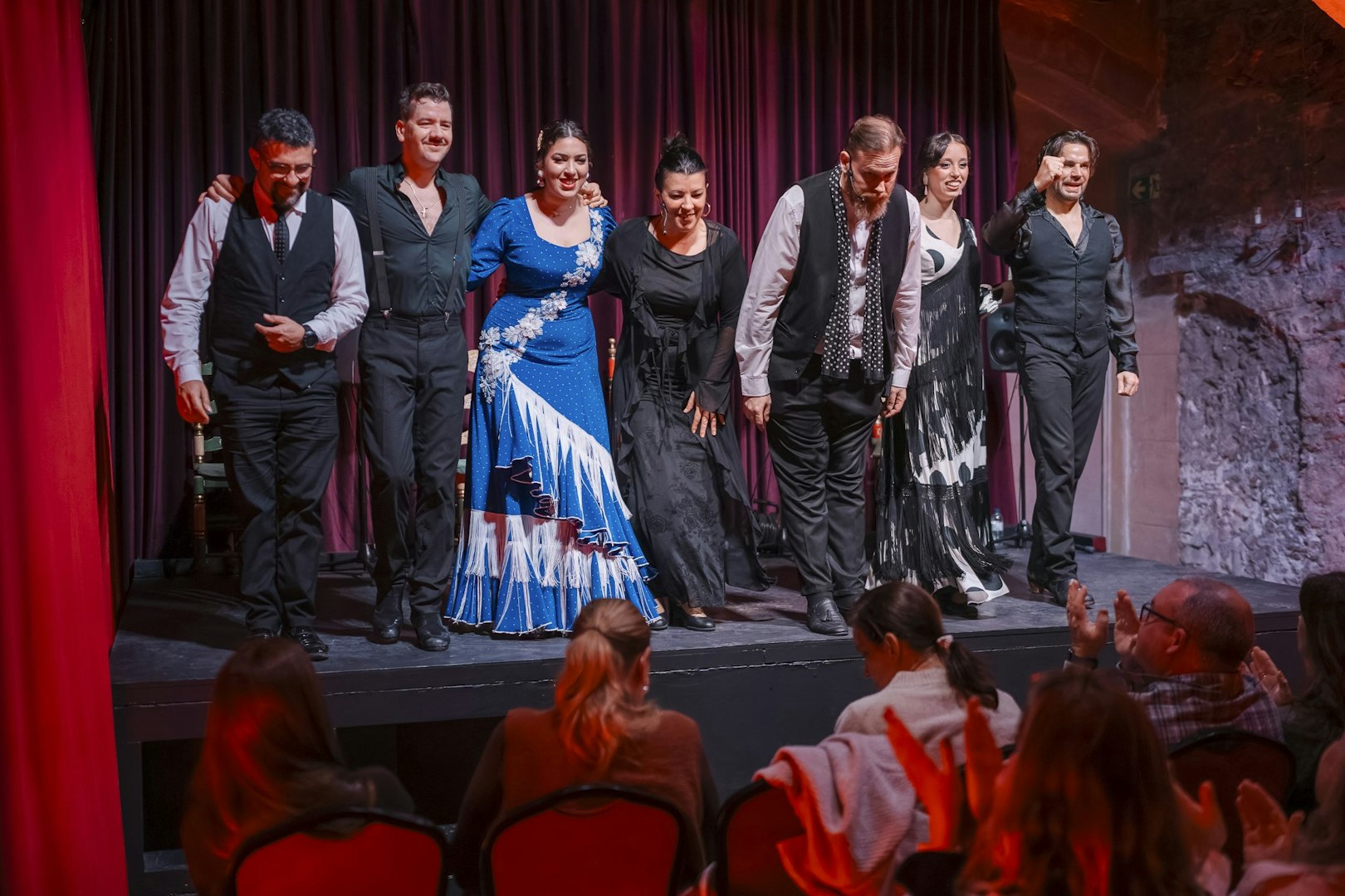 Performers bowing at Palau Dalmases Flamenco Show in Barcelona.