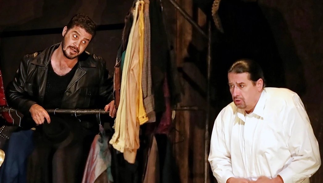 Actors performing in a scene from the Rigoletto show production.
