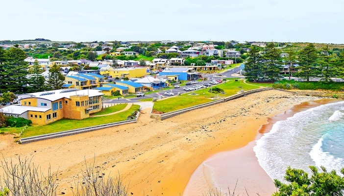 Port Campbell beach along Great Ocean Road with rocky cliffs and ocean waves.