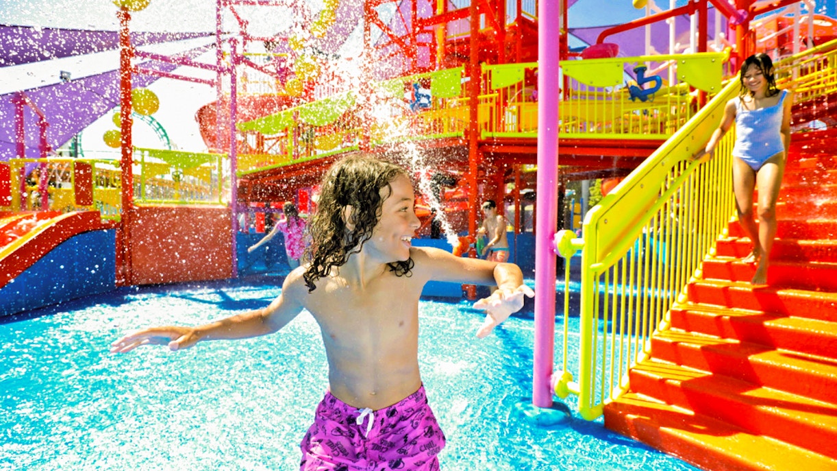 Children enjoying water slides at WhiteWater World, Gold Coast, Australia.