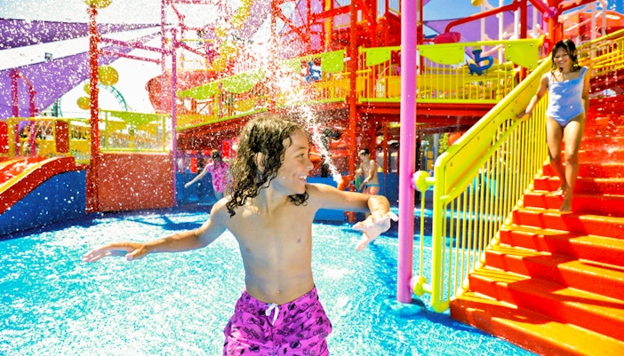 Children enjoying water slides at WhiteWater World, Gold Coast, Australia.