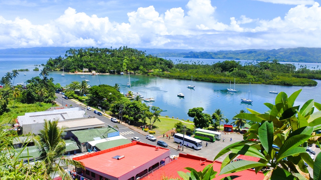 Aerial view of Savusavu harbor with boats and lush greenery, Vanua Levu, Fiji.