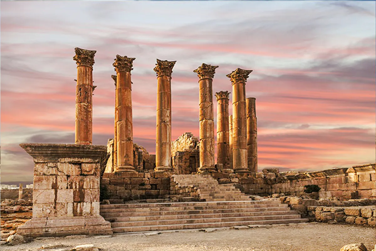 Roman columns at Jerash ruins during sunset, part of Jerash & Ajloun Castle Day Trip from Amman.