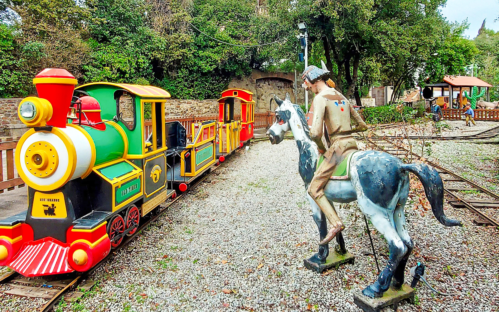 Miniature train and cowboy statue at Rio Grande, Tibidabo Amusement Park.