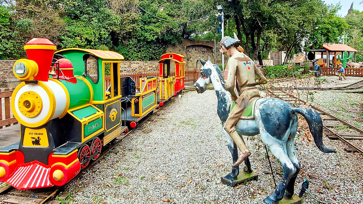 Miniature train and cowboy statue at Rio Grande, Tibidabo Amusement Park.