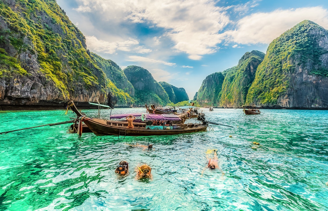 Snorkeling in clear waters at Maya Bay, Phi Phi Islands, Thailand.