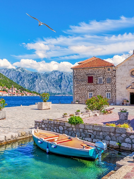 Church of Our Lady of the Rocks with boat in Bay of Kotor, Montenegro.