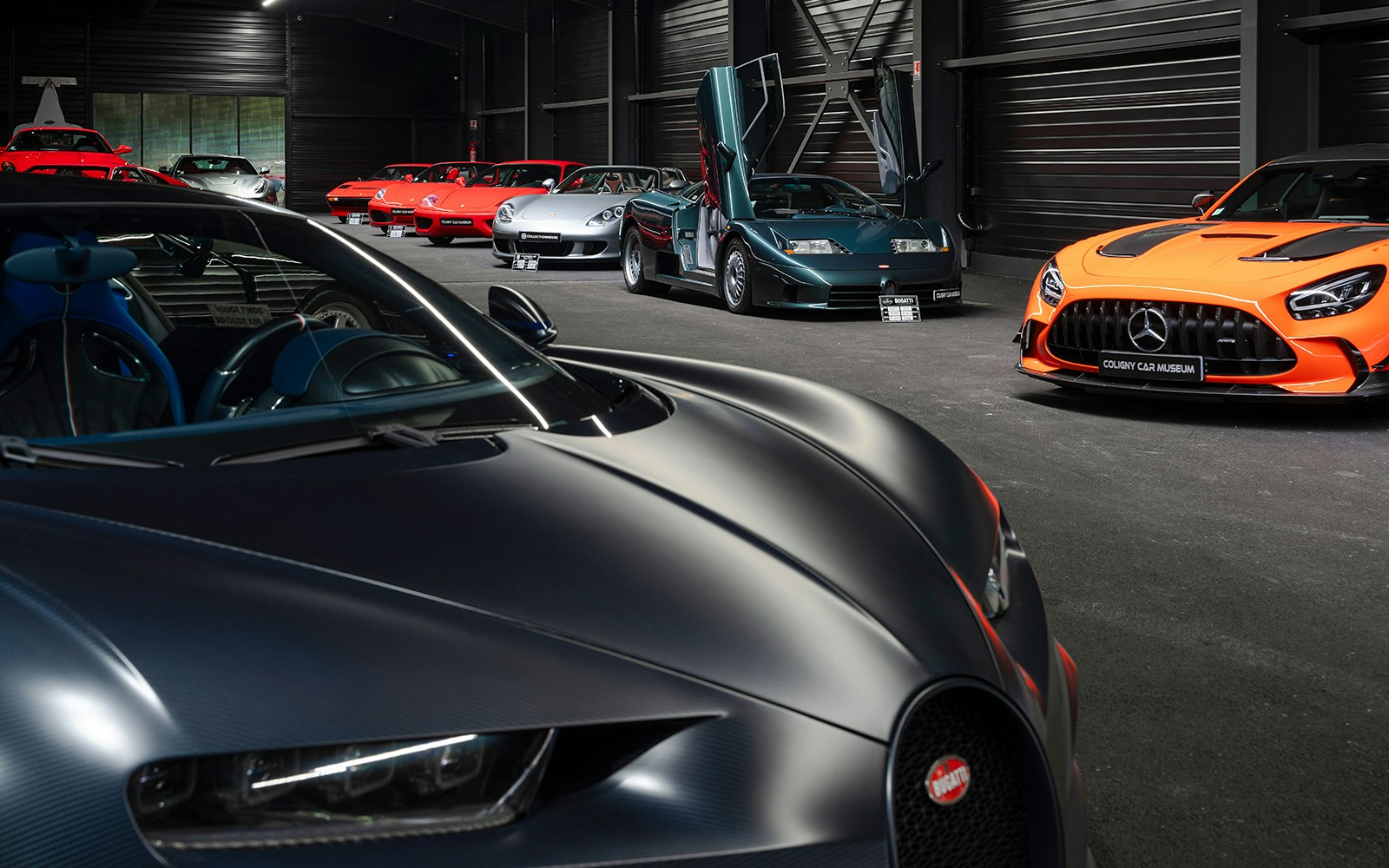 Classic and luxury cars displayed at Coligny Car Museum in Lyon, France.