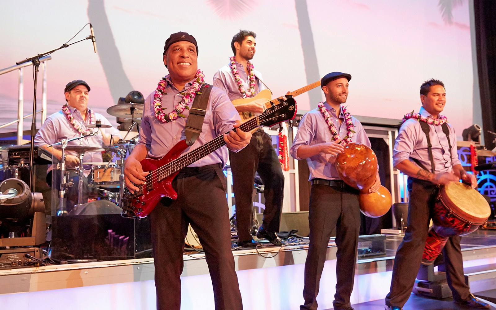 Performers playing instruments at the Rock-a-Hula show in Hawaii.