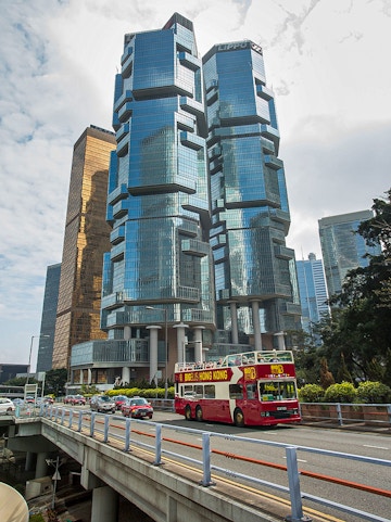 Big Bus Hong Kong passing Lippo Centre skyscrapers in Hong Kong.