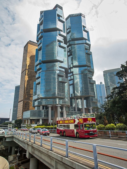 Big Bus Hong Kong passing Lippo Centre skyscrapers in Hong Kong.