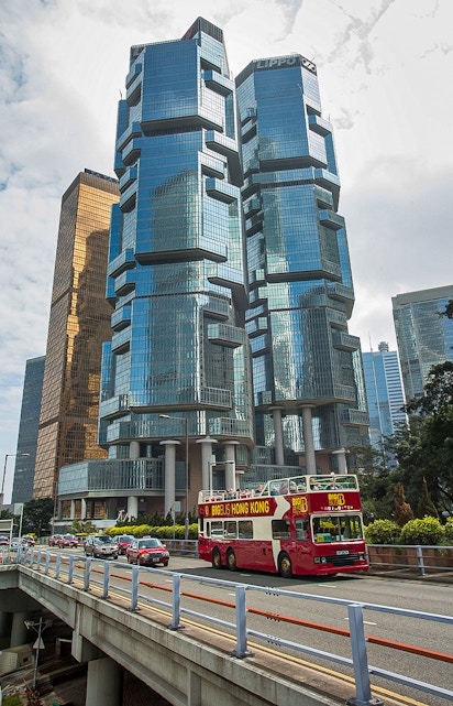 Big Bus Hong Kong passing Lippo Centre skyscrapers in Hong Kong.
