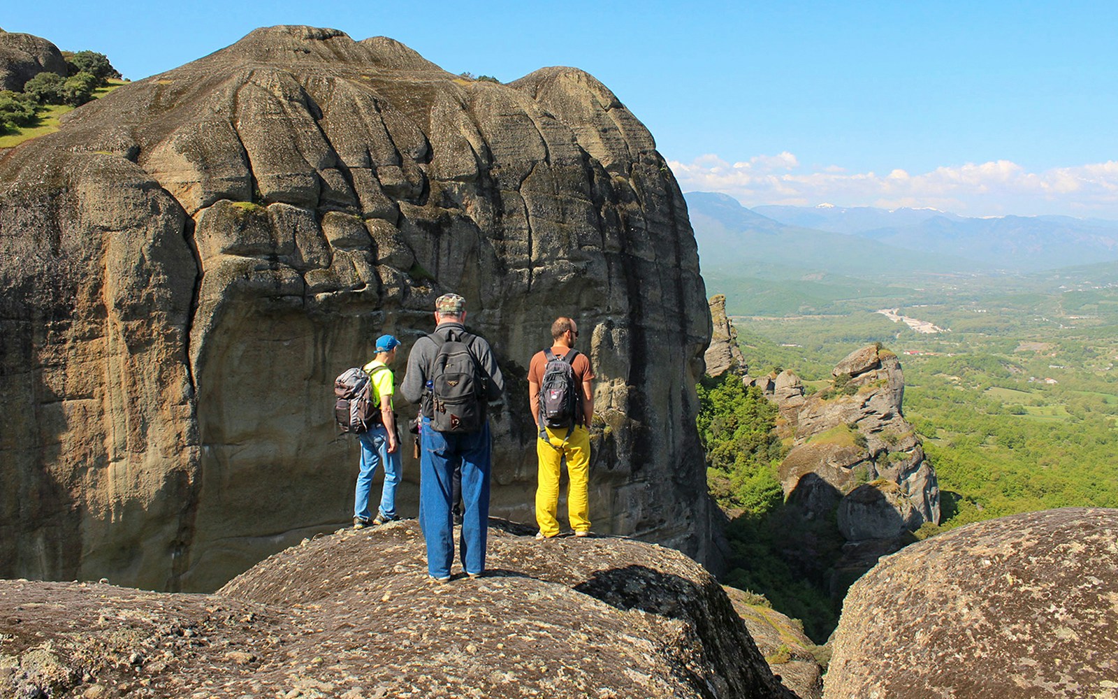 Guests hiking on rocky terrain during Meteora Hiking Tour, Greece.