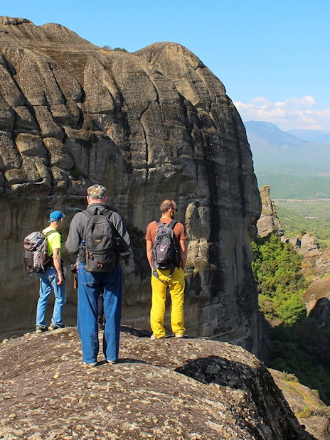 Guests hiking on rocky terrain during Meteora Hiking Tour, Greece.