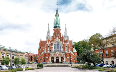 St. Joseph’s Church in Krakow, Poland, with Gothic architecture and surrounding square.