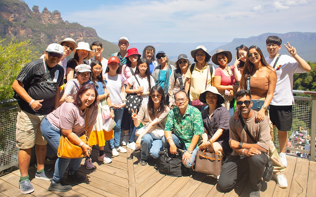 Group of tourists at Blue Mountains lookout during Sydney tour.
