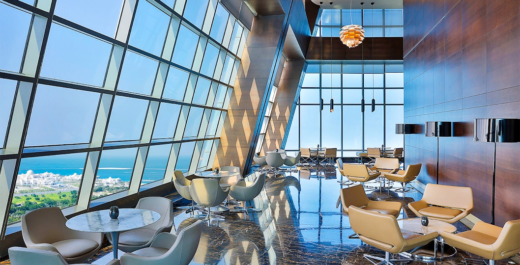 Observation Deck at 300, Etihad Tower, Abu Dhabi with city and sea view through large windows.