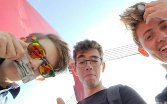 Three people enjoying the Rotterdam Modern Time Portal Travel self-guided city exploration game.