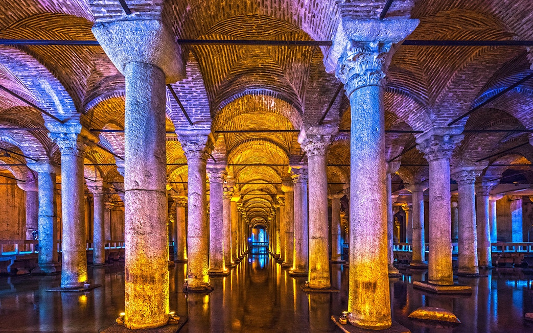 Basilica Cistern illuminated columns and arches, Istanbul guided tour.