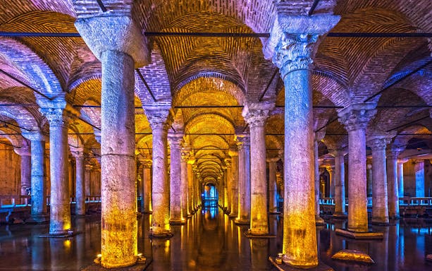 Basilica Cistern illuminated columns and arches, Istanbul guided tour.