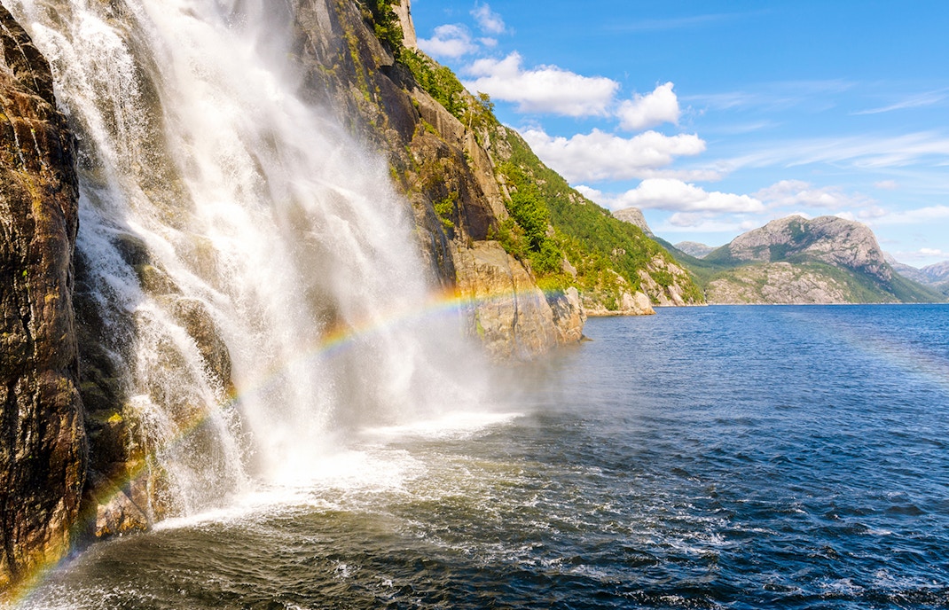Lysefjord waterfall cascading down rocky cliffs in Lysefjord, Norway.