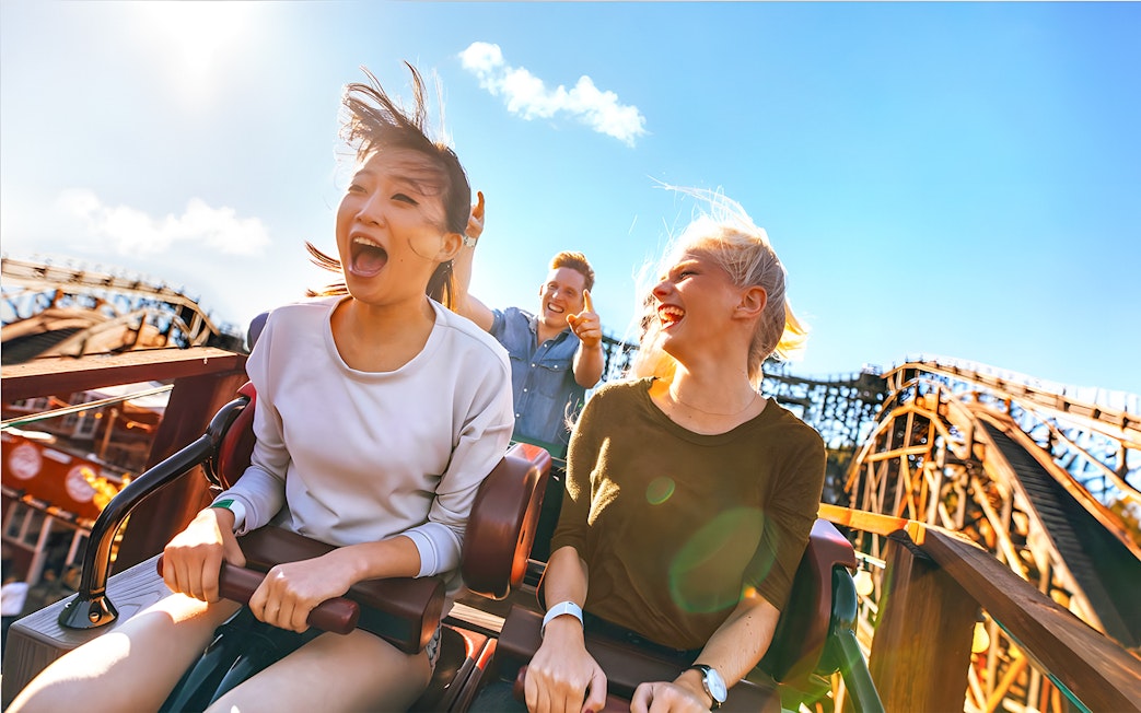 People enjoying a roller coaster ride at Real Madrid World, Dubai.