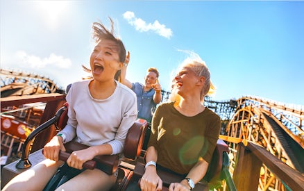 People enjoying a roller coaster ride at Real Madrid World, Dubai.