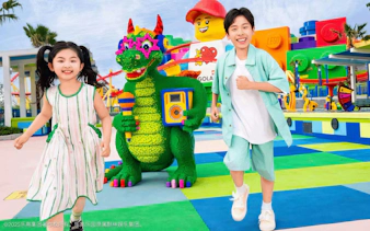 Kids enjoying colorful Lego dragon at Legoland Shanghai.
