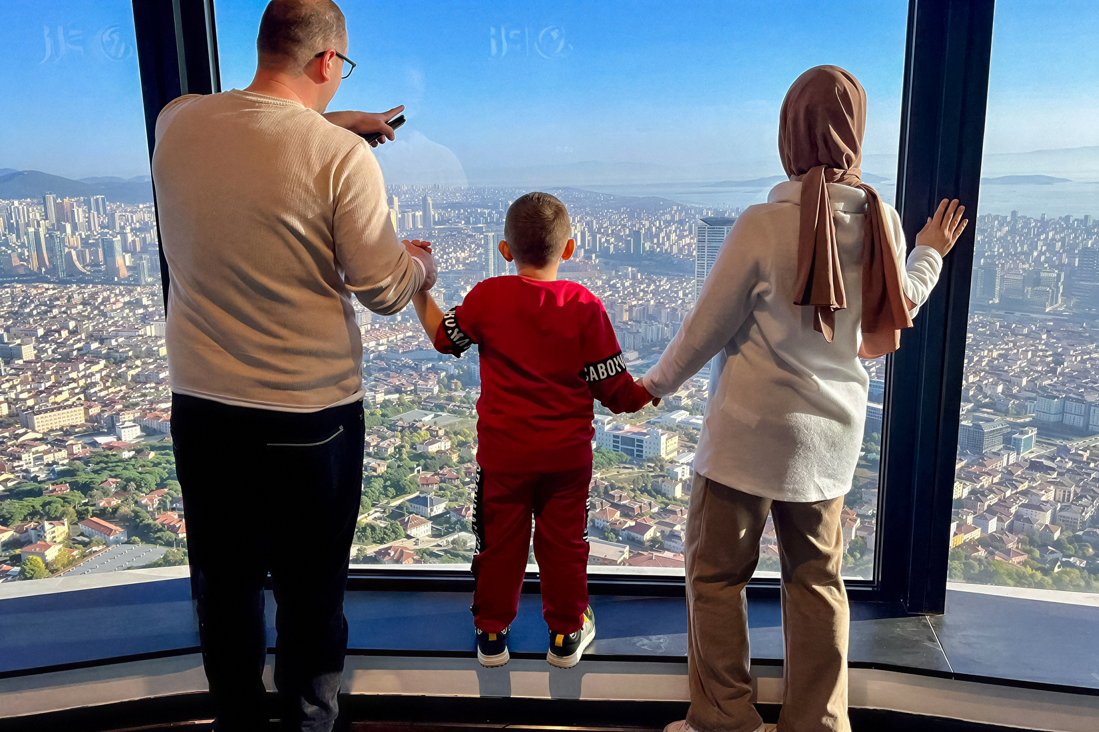 Guests enjoying the view from Camlica Tower Observation Deck, Istanbul, Turkey.