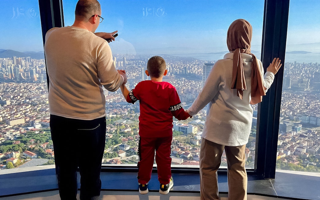 Guests enjoying the view from Camlica Tower Observation Deck, Istanbul, Turkey.