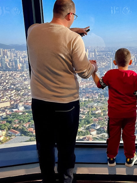 Guests enjoying the view from Camlica Tower Observation Deck, Istanbul, Turkey.