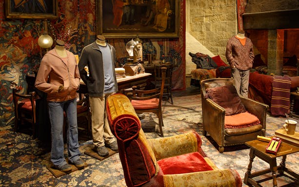Models in Gryffindor common room set during Harry Potter London tour.