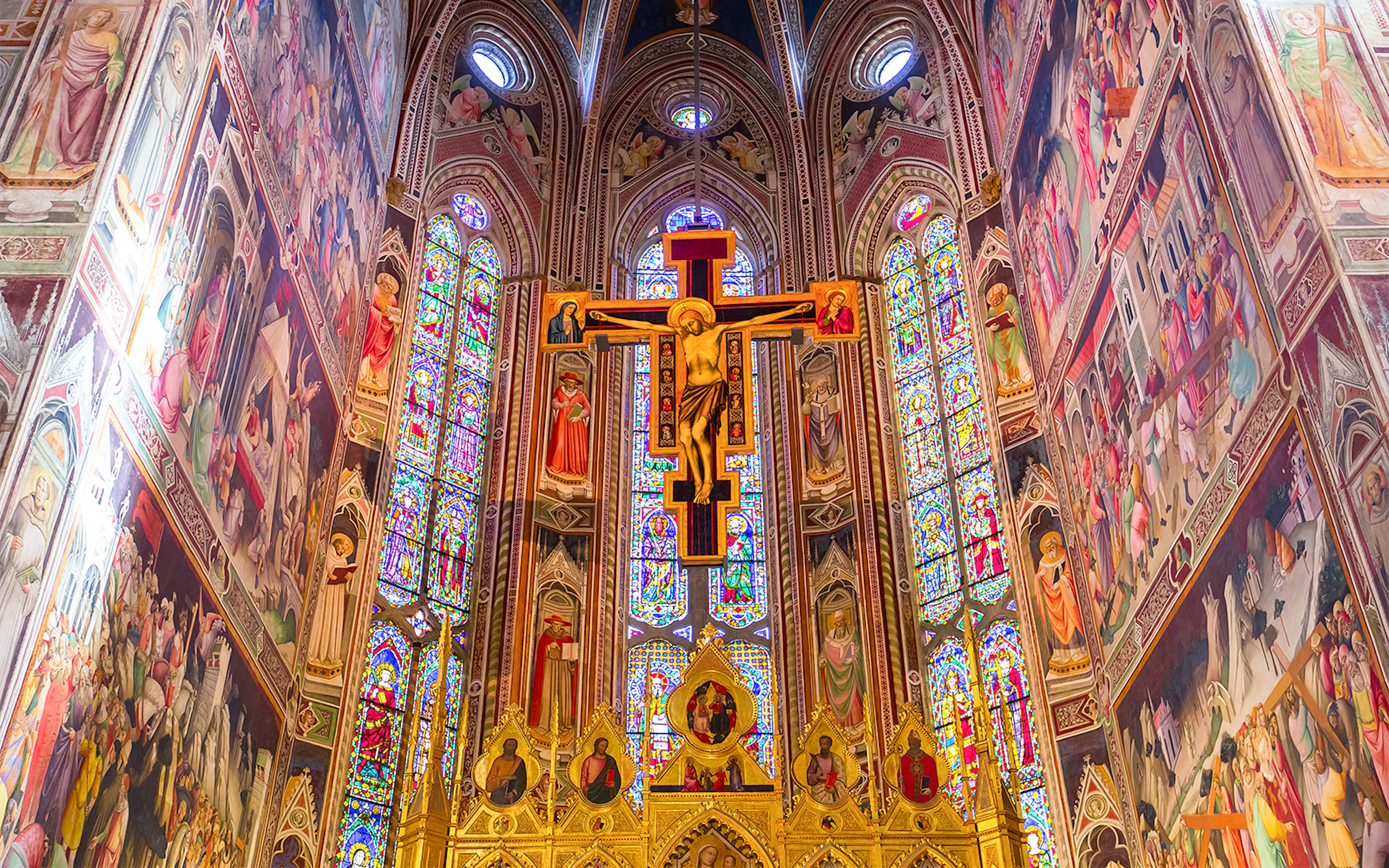 Interior frescoes and stained glass in Basilica of Santa Croce, Florence.