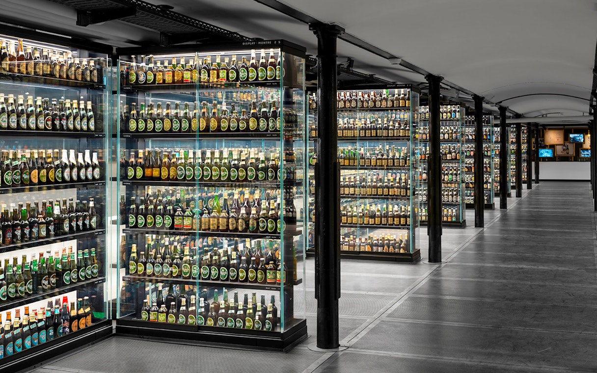 Carlsberg beer bottle collection display inside Home of Carlsberg exhibit.