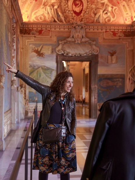 Guide leading tour group through Gallery of Maps, Vatican Museum.