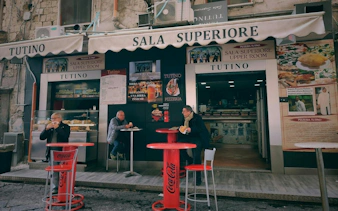 Outdoor seating at Tutino pizzeria in Naples, part of the Curse of Naples Mafia Secrets tour.